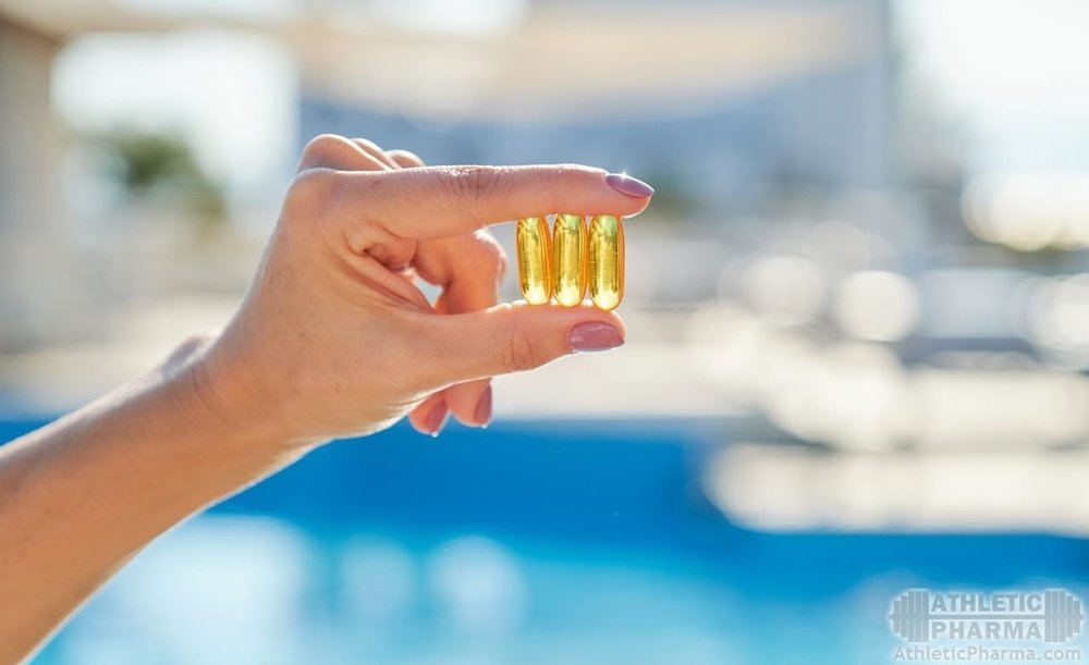 Рыбий жир (капсулы) в руке